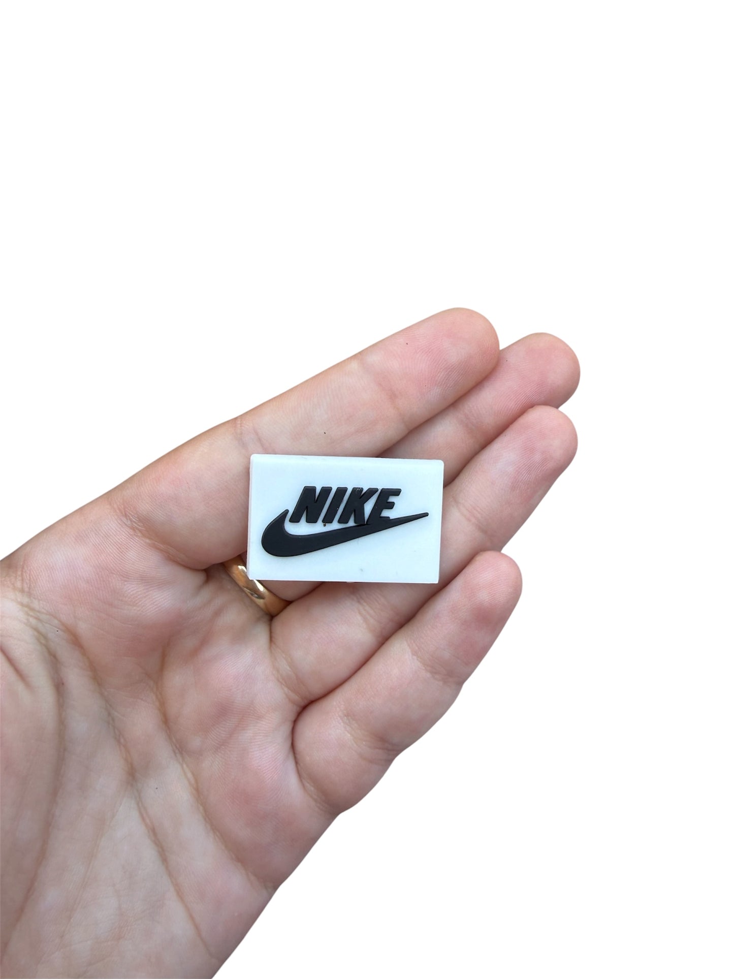 Black and white nìke shoe charm